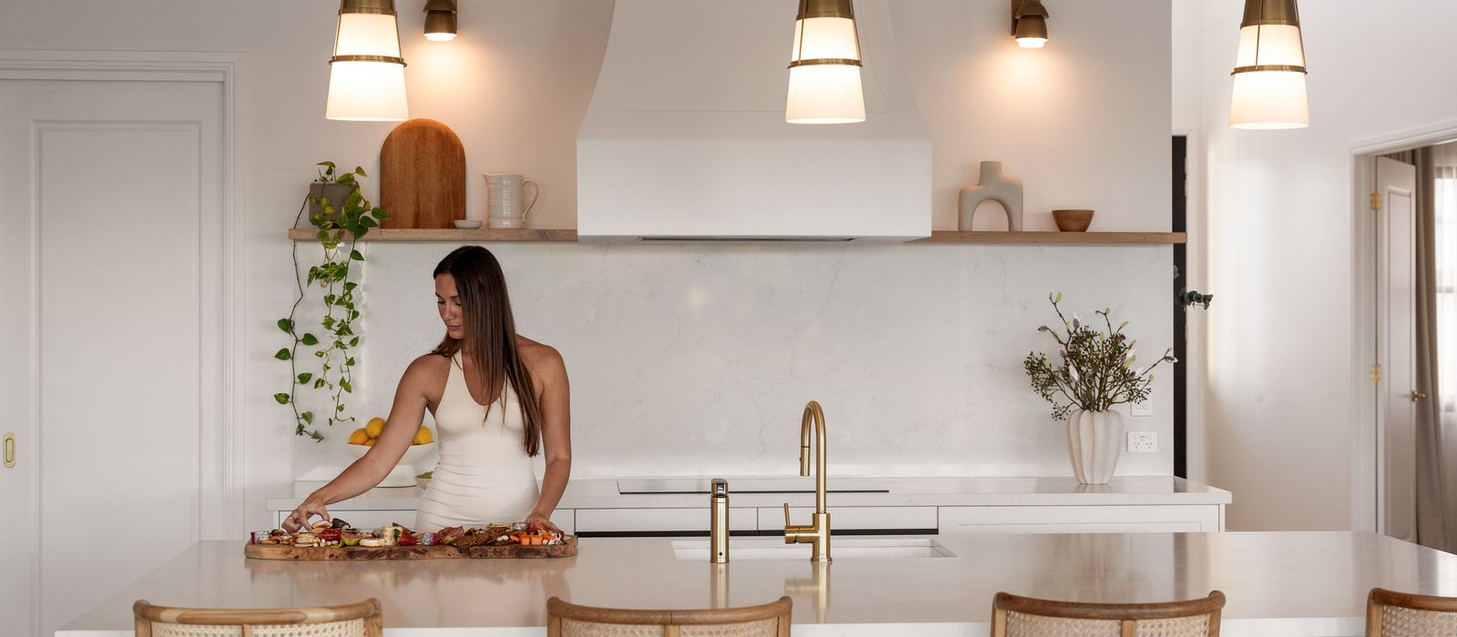 Guests at the kitchen island of an Aryve residence